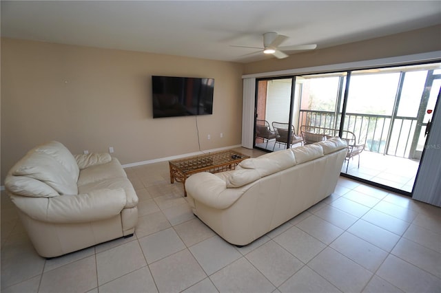 tiled living room with ceiling fan