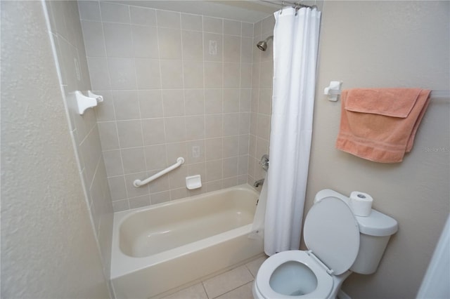 bathroom featuring shower / bath combo with shower curtain, toilet, and tile patterned flooring