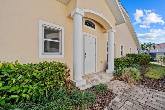 3743 Albacete Cir Unit 84, Punta Gorda, FL 33950 - doorway to property with stucco siding