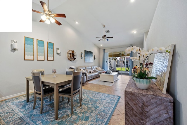 dining room featuring high vaulted ceiling, light tile patterned floors, and ceiling fan