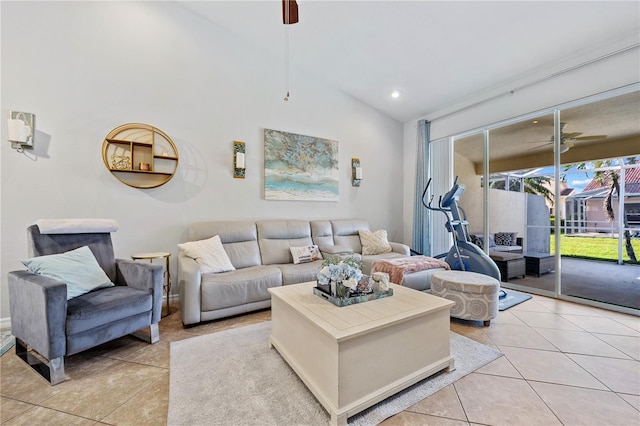 tiled living room with ceiling fan and vaulted ceiling