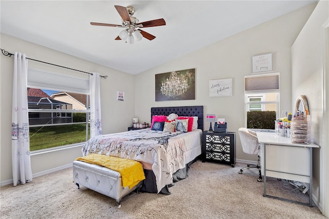 bedroom with ceiling fan, carpet flooring, and vaulted ceiling