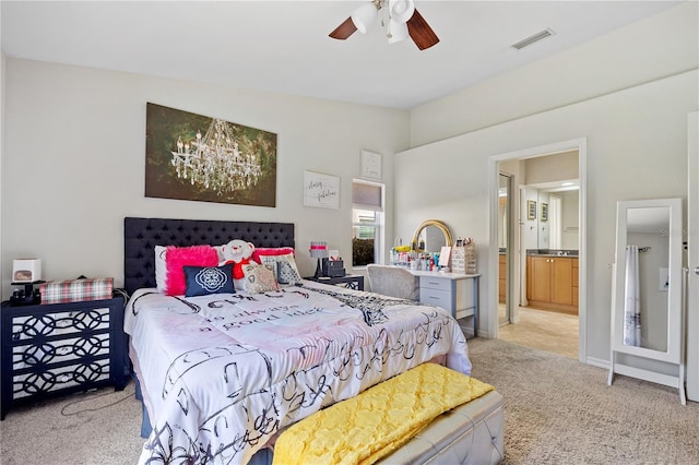 carpeted bedroom with connected bathroom and ceiling fan