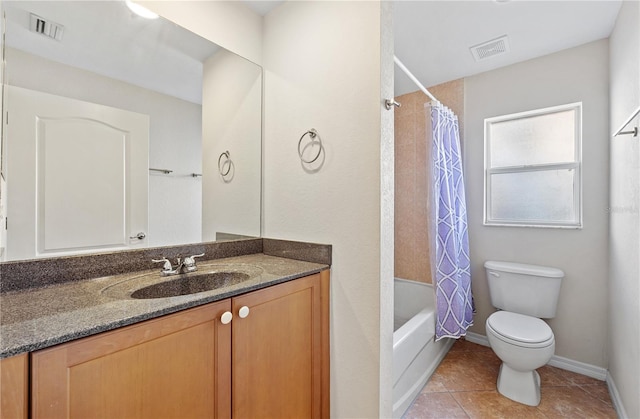 full bathroom featuring vanity, shower / bath combination with curtain, toilet, and tile patterned floors