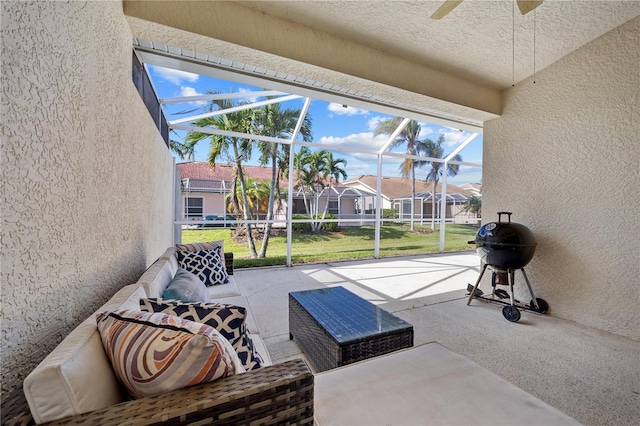 3743 Albacete Cir Unit 84, Punta Gorda, FL 33950 - unfurnished sunroom featuring a ceiling fan, a residential view, and an outdoor hangout area