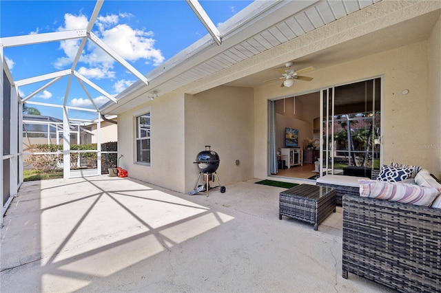 view of patio / terrace featuring a lanai, outdoor lounge area, and ceiling fan