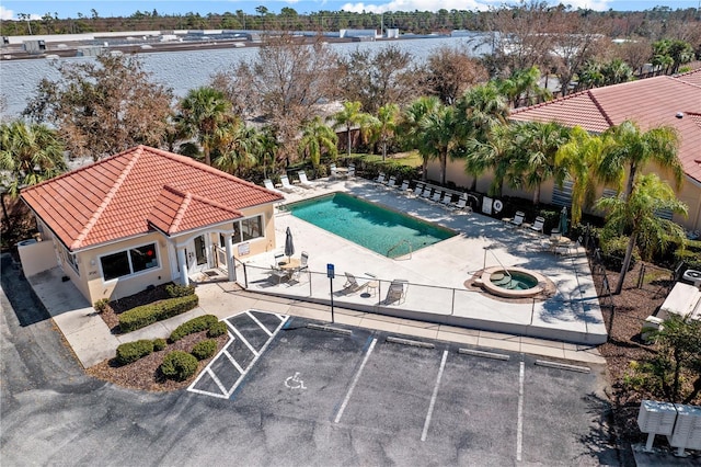 3743 Albacete Cir Unit 84, Punta Gorda, FL 33950 - drone / aerial view of a pool and a large body of water