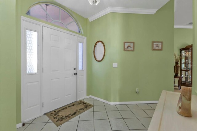 2831 Corinthia Cir, North Fort Myers, FL 33917 - entrance foyer with baseboards, ornamental molding, and light tile patterned flooring