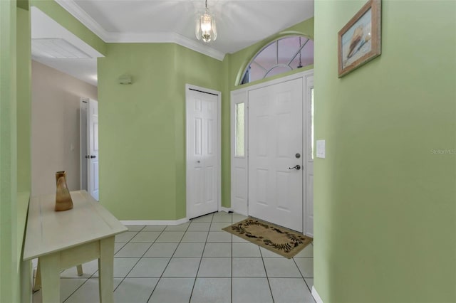 2831 Corinthia Cir, North Fort Myers, FL 33917 - foyer with crown molding, baseboards, and light tile patterned flooring