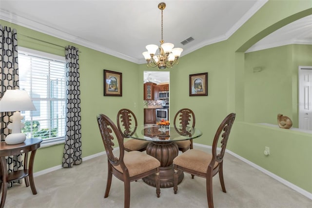 dining area featuring light carpet, a notable chandelier, and ornamental molding