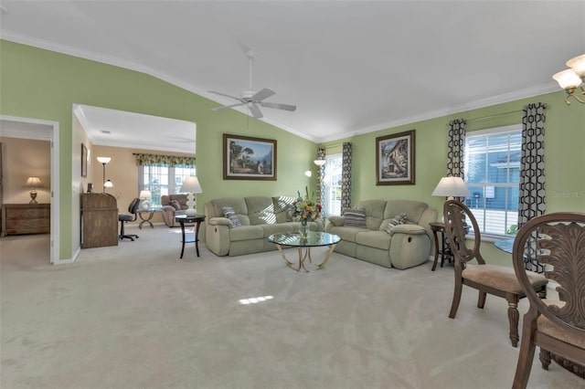 carpeted living room with ornamental molding, ceiling fan, and vaulted ceiling