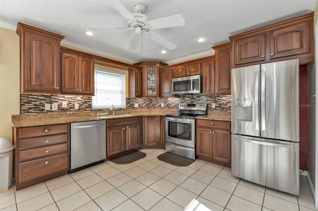 2831 Corinthia Cir, North Fort Myers, FL 33917 - kitchen featuring a sink, appliances with stainless steel finishes, ceiling fan, and tasteful backsplash