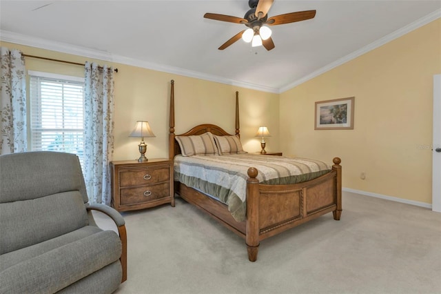 carpeted bedroom with ornamental molding, vaulted ceiling, and ceiling fan