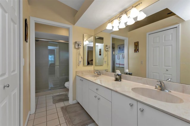 2831 Corinthia Cir, North Fort Myers, FL 33917 - full bathroom featuring toilet, tile patterned floors, a sink, and a stall shower