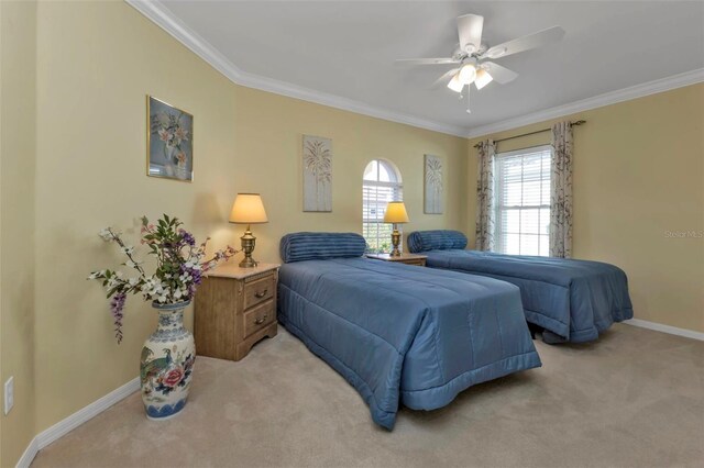 2831 Corinthia Cir, North Fort Myers, FL 33917 - bedroom with baseboards, ornamental molding, ceiling fan, and light colored carpet