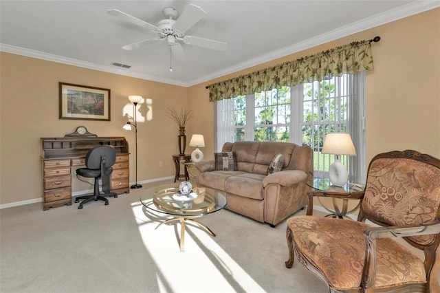 living room with crown molding, carpet floors, and ceiling fan