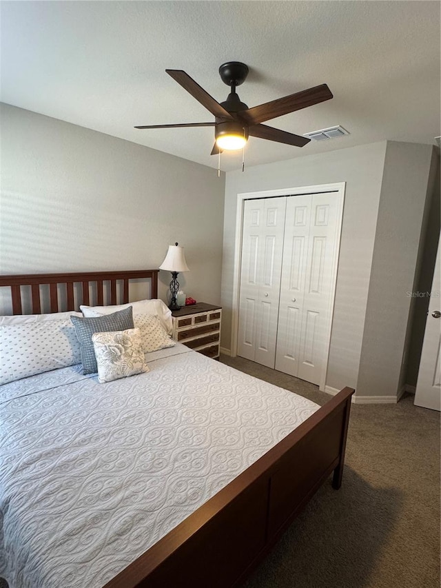 bedroom featuring carpet, ceiling fan, and a closet