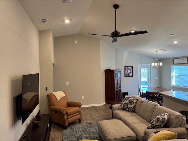 living room with wood-type flooring, ceiling fan with notable chandelier, and vaulted ceiling