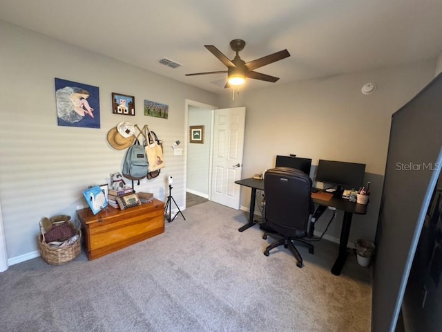 office space featuring ceiling fan and carpet floors