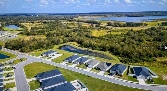 birds eye view of property featuring a water view