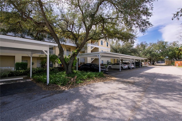 view of parking / parking lot with a carport