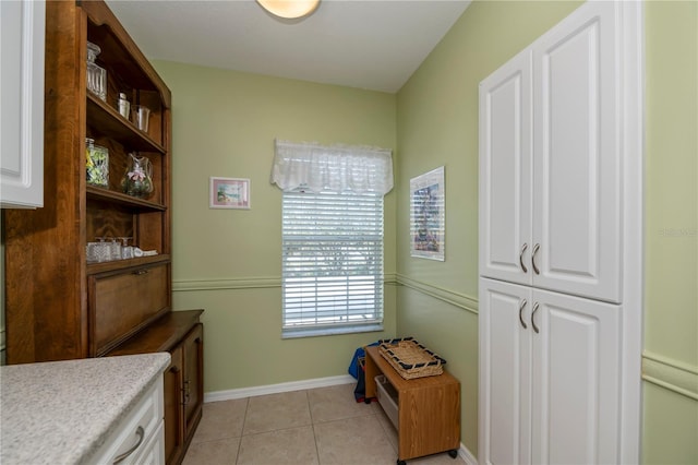 interior space featuring light tile patterned floors