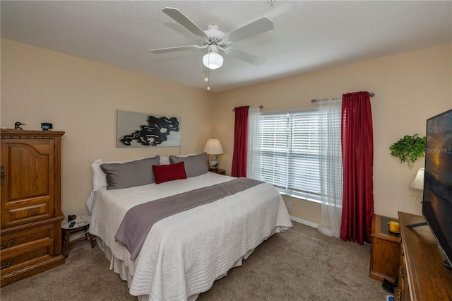 bedroom featuring light carpet and ceiling fan