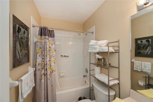 bathroom featuring shower / bath combination with curtain and toilet