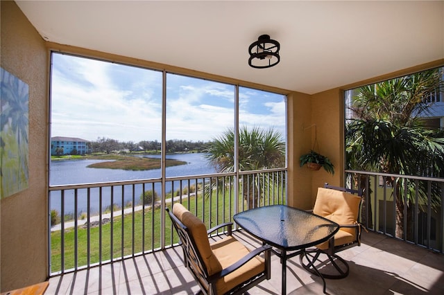 sunroom with a water view