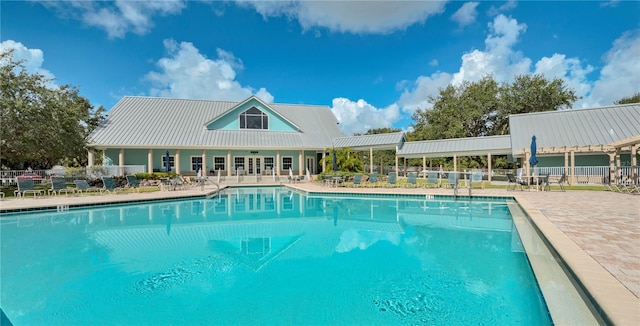 view of swimming pool featuring a patio area