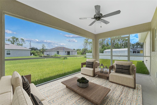 sunroom featuring ceiling fan