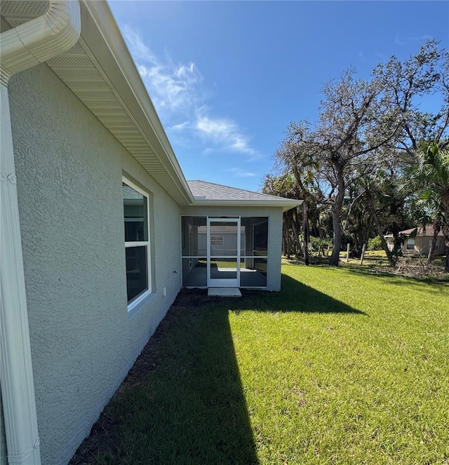 view of yard with a sunroom