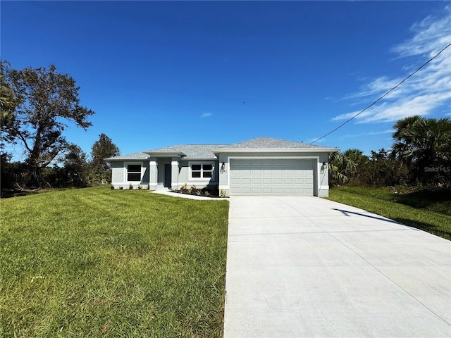 view of front of home featuring a front lawn and a garage