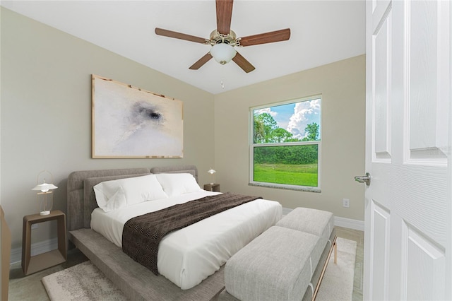 bedroom with ceiling fan and light colored carpet