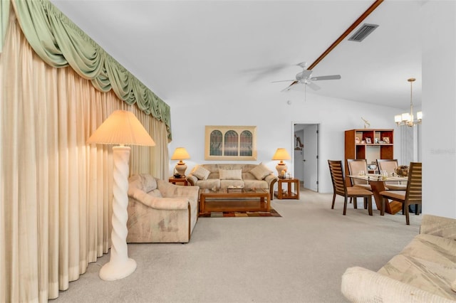 living room featuring carpet, vaulted ceiling, and ceiling fan with notable chandelier