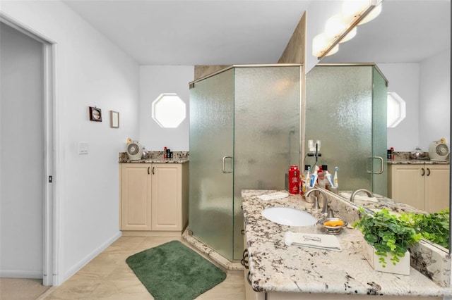 bathroom with vanity and a shower with shower door