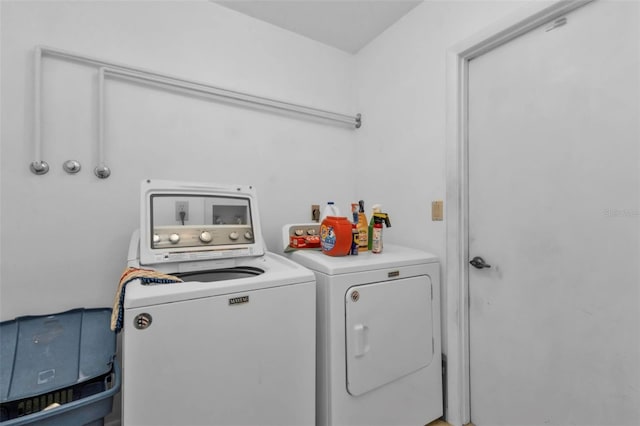 laundry room featuring washer and clothes dryer