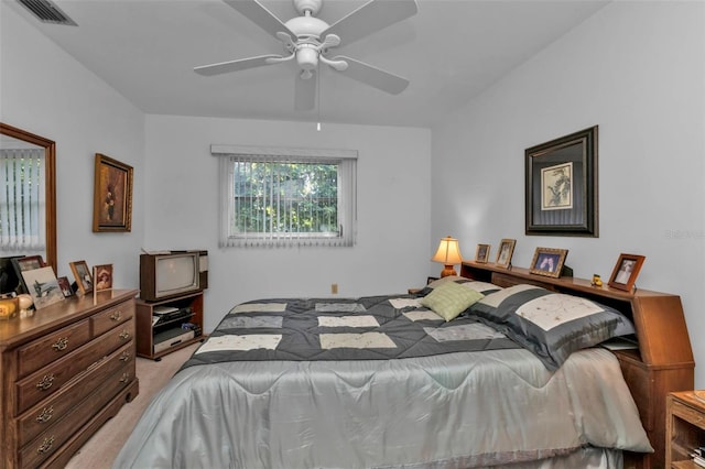 bedroom featuring light carpet and ceiling fan