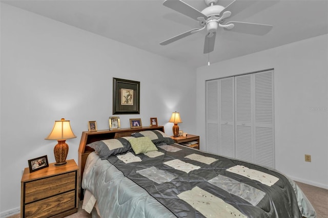 carpeted bedroom featuring a closet and ceiling fan