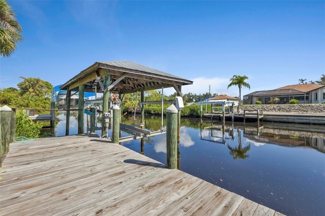 view of dock featuring a water view and a lanai