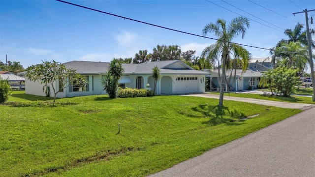 ranch-style home with a front yard and a garage