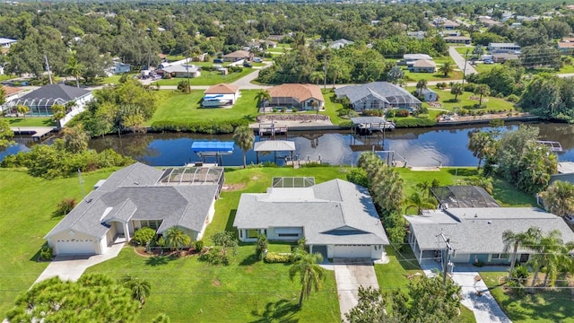 birds eye view of property featuring a water view