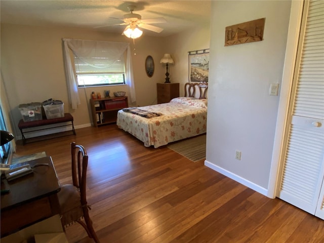 bedroom with ceiling fan and hardwood / wood-style flooring