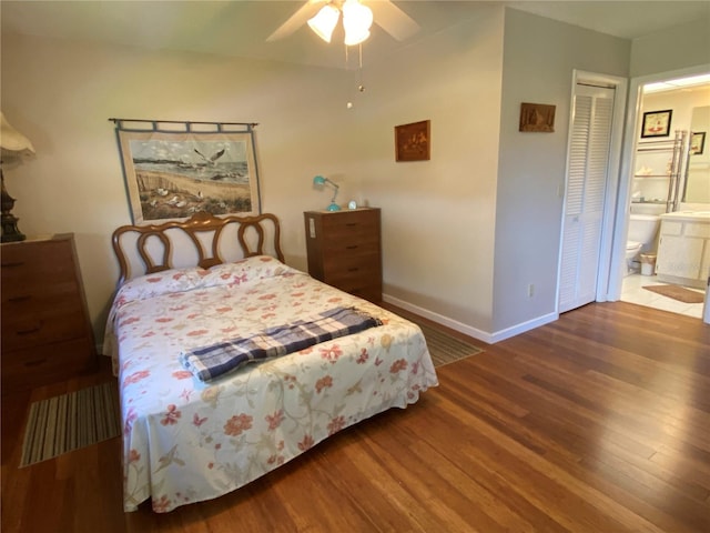 bedroom featuring ensuite bath, wood-type flooring, and ceiling fan