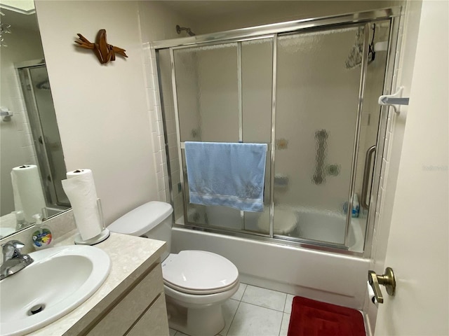 full bathroom with toilet, enclosed tub / shower combo, vanity, and tile patterned flooring