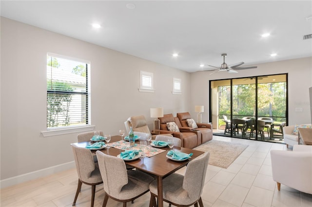 dining room with a wealth of natural light and ceiling fan