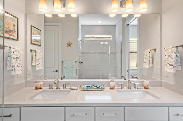 bathroom with vanity and a shower with shower door