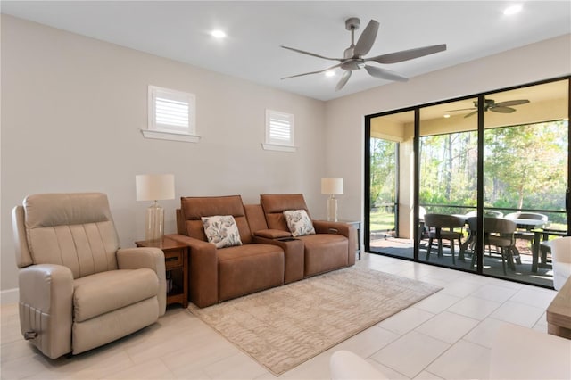 living room featuring ceiling fan and light tile patterned floors