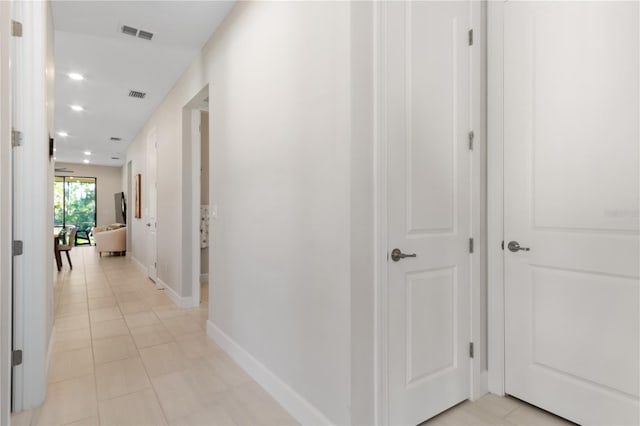 hallway with light tile patterned flooring