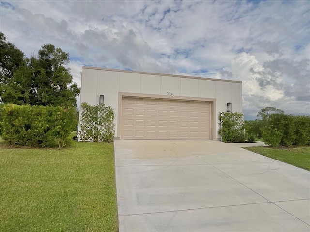 garage featuring a lawn